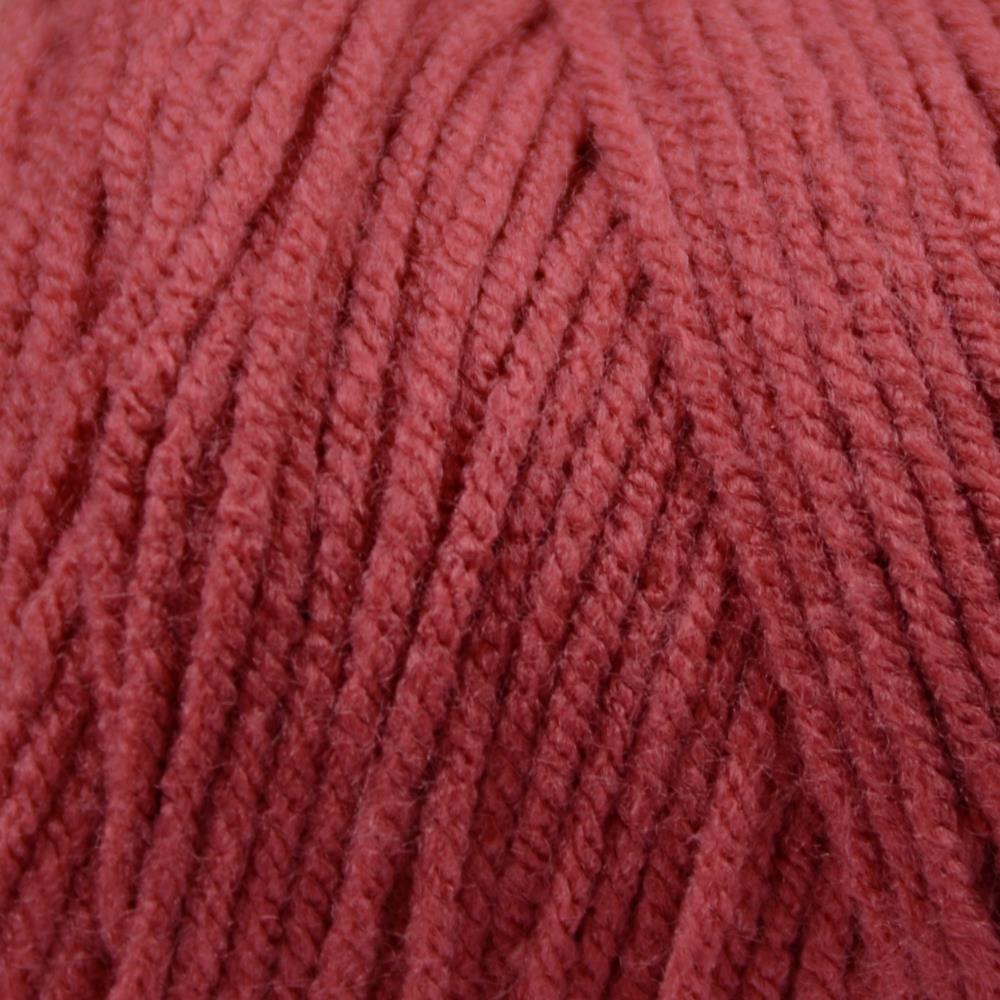 Close-up of a ball of red yarn with textured pattern