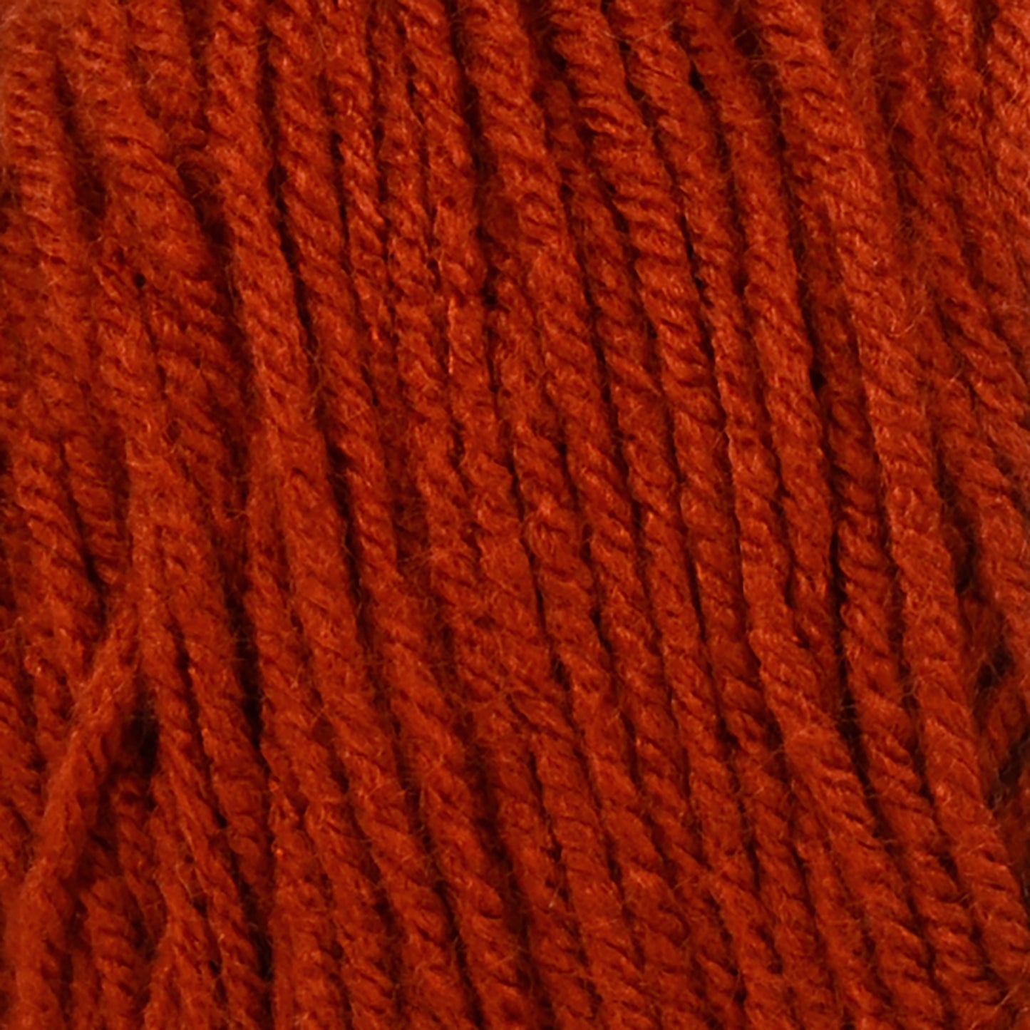 Close-up of red yarn with a textured pattern